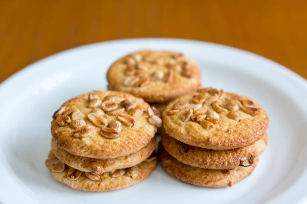 istock Cookies with peanuts on a white plate. Cookies close-up. 1160527948