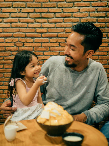 istock Asian family having dinner together with dessert. 1160528013