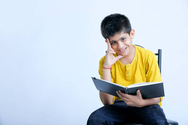 istock young cute indian child standing over white background 1160529410