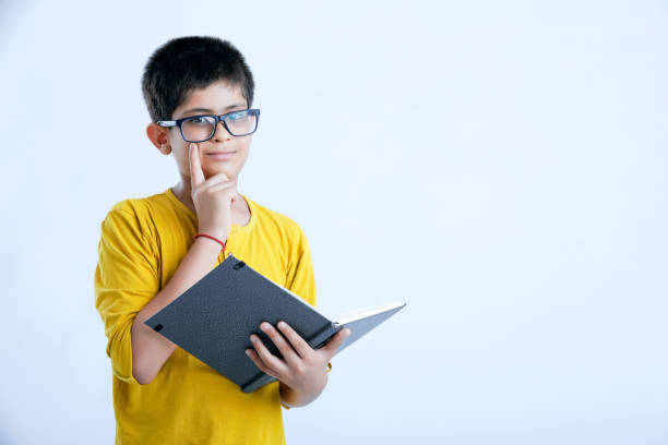 istock young cute indian child standing over white background 1160530088