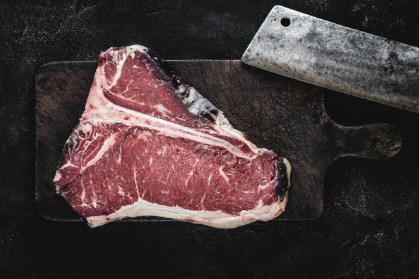 istock Dry Aged Beef Raw T-bone Steak on Vintage Cutting Board 1160530208