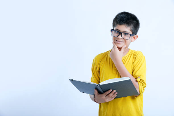 istock young cute indian child standing over white background 1160531127