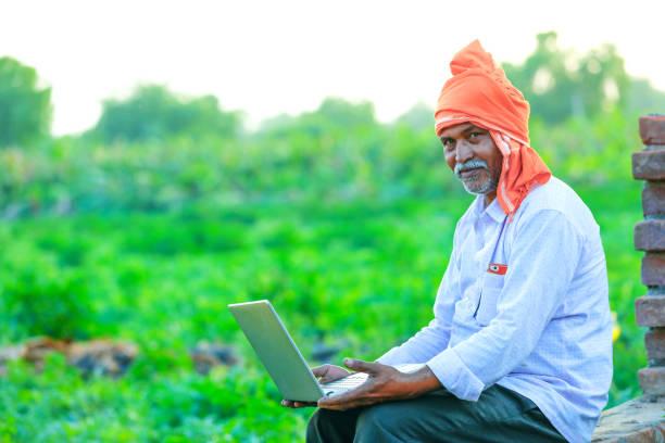 istock Young indian farmer at field 1160531258