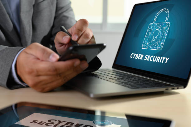 istock CYBER SECURITY Business, technology, internet and networking concept. Young businessman working on his laptop 1160533153