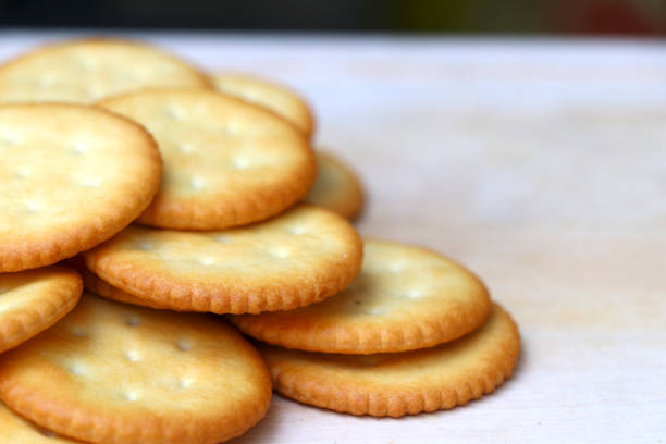 istock Biscuits are stacked on the wooden table with selective focus. 1160533220