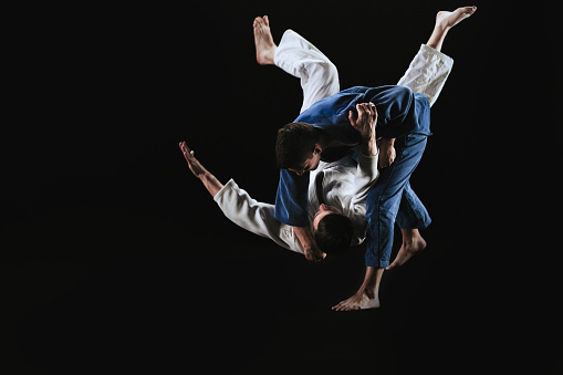 Male Judoka Throwing His Partner To The Ground