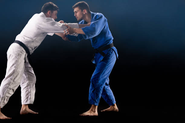istock Judo Players Competing During Match 1160533320