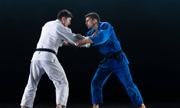 istock Judo Players Competing During Match 1160533341