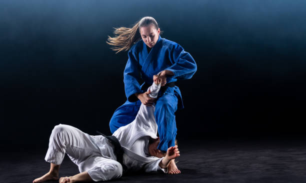 istock Female Judo Players Competing During Match 1160533343