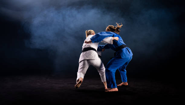 istock Female Judo Players Competing During Match 1160533397