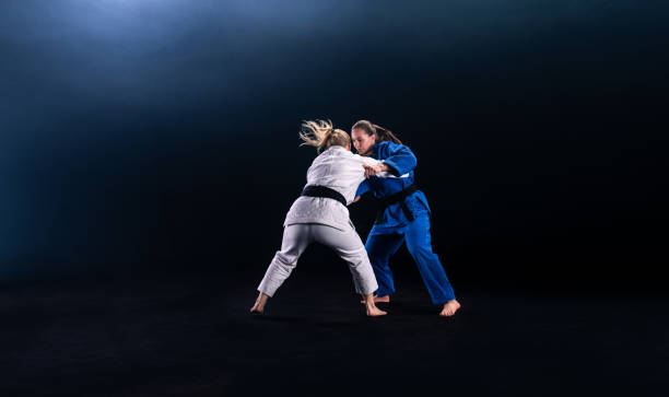 istock Female Judo Players Competing During Match 1160533403