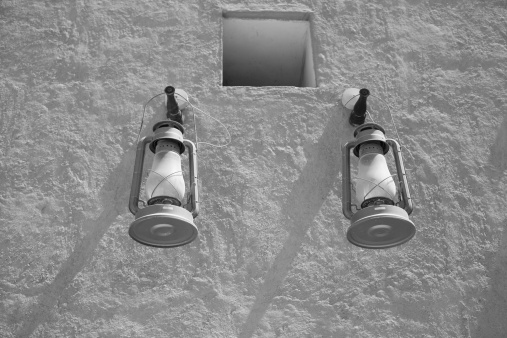 two lanterns on top of a house