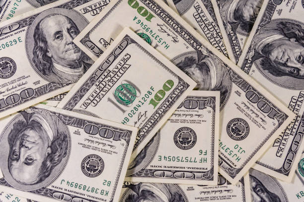 Background of the many american one hundred dollar banknotes stock photo