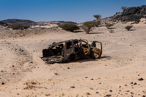Frames of burnt vehicles are ubiquitous roadside in Saudi Arabia. May 2019.