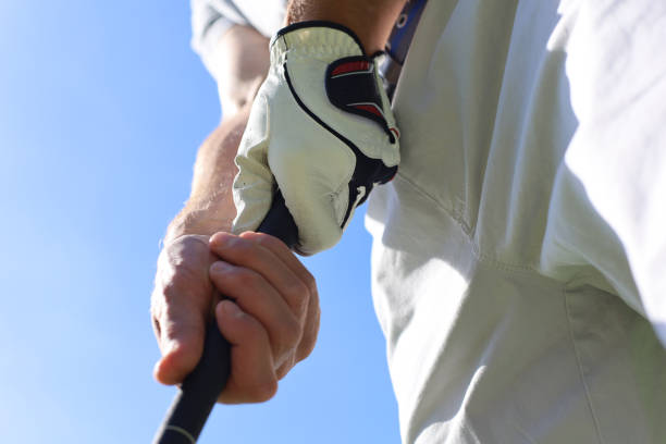 istock Golfer wearing a golf holding a putter. 1160536248