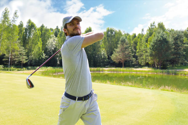 istock Golfer hitting golf shot with club on course while on summer vacation. 1160536281
