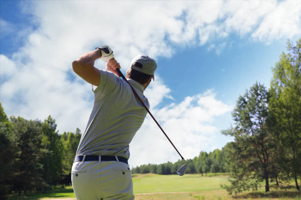 istock Golfer hitting golf shot with club on course while on summer vacation. 1160536865