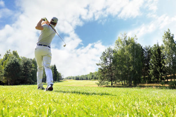 istock Golfer hitting golf shot with club on course while on summer vacation. 1160536867