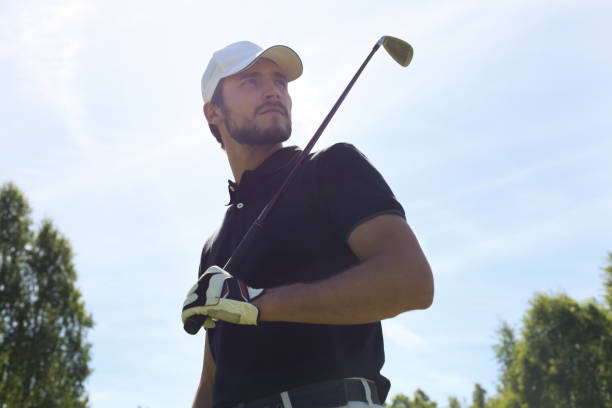 istock Man playing golf on beautiful sunny green golf course. 1160536930