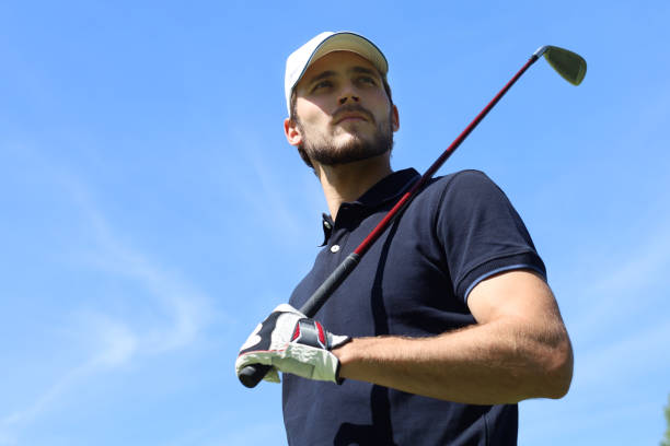istock Athletic young man playing golf in golfclub. 1160537029