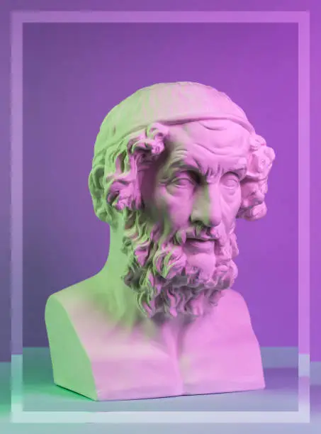 Gypsum copy of ancient statue of Homer head for artists on a purple background. Plaster sculpture of man face.