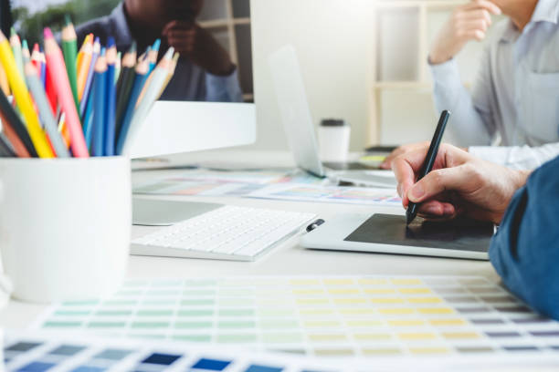 istock Graphic designer drawing on graphics tablet at workplace 1160539638