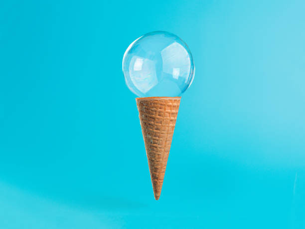 istock Ice cream cone with soap bubble on blue background 1160540879