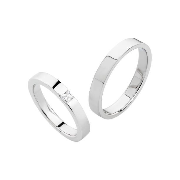 istock Pair of silver wedding rings isolated on white background 1160543799