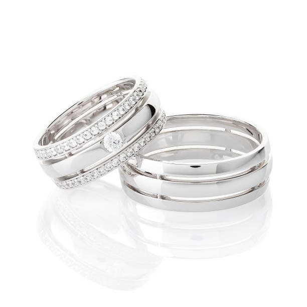 istock Pair of silver wedding rings isolated on white background 1160543802