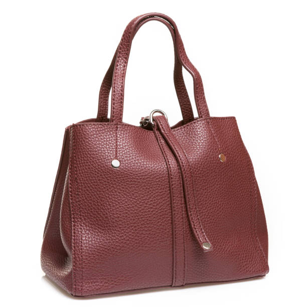 istock leather brown women's bag, on a white background, textured leather 1160544119
