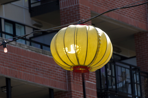 Yellow  lanterns hanging  over Fisgard street in Chinatown, Victoria, British Columbia