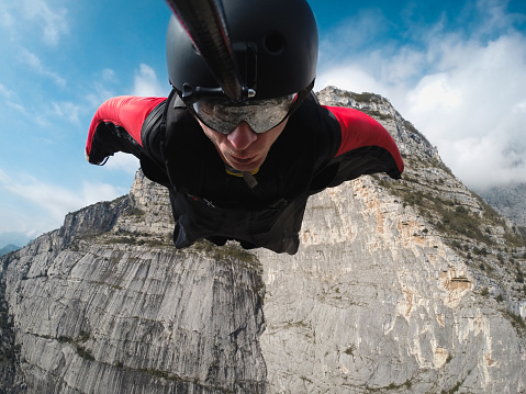 base jumper in flight from the cliff, base jumping, wingsuit