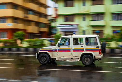 Mumbai, India - June 30, 2019 : Mumbai police patrol van running on a street of Marine drive