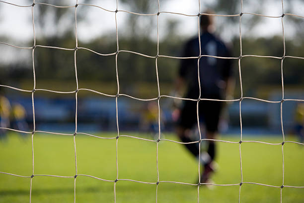 istock goal net and a goalkeeper out of focus 116054594
