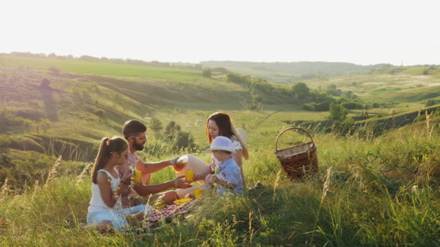 Happy family spends time on a picnic