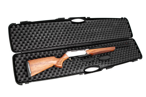 istock Modern semi-automatic hunting rifle with a wooden butt in an open plastic case. Isolate on a white background. 1160548277