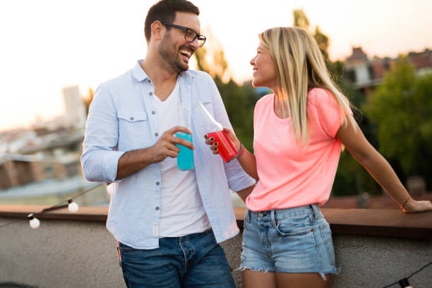 istock Happy couple having fun time at party 1160549408
