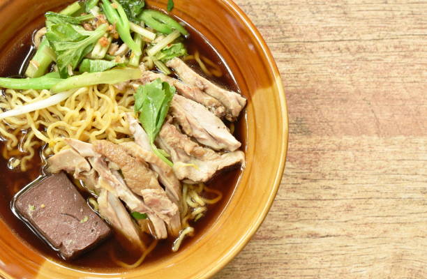 istock egg noodles with boiled duck in Chinese herb brown soup 1160550687