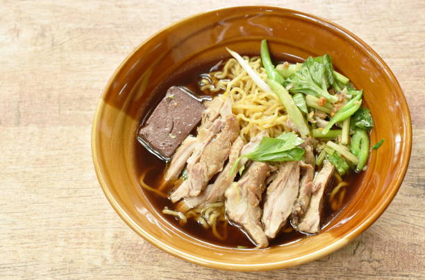 istock egg noodles with boiled duck in Chinese herb brown soup 1160550688