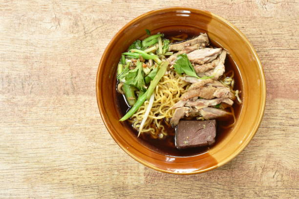 istock egg noodles with boiled duck in Chinese herb brown soup 1160550730