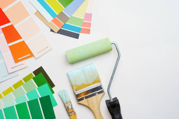 istock Image of palette with blue and green colors, roller, brushes 1160550798