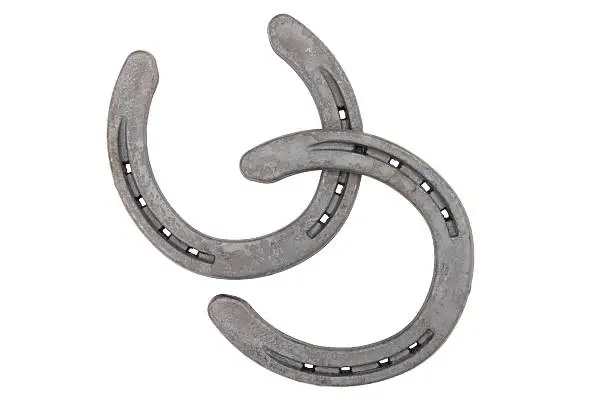 A pair of horseshoes on a white background.