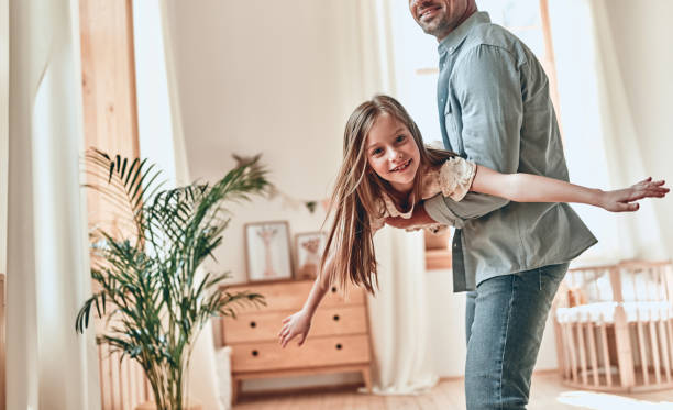 istock Father and daughter at home 1160553349
