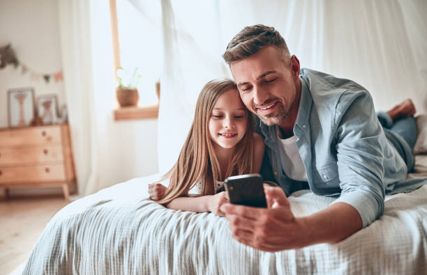 istock Father and daughter at home 1160553411