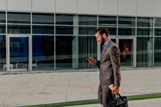 istock Businessman Using Smartphone in the Urban Environment 1160554689
