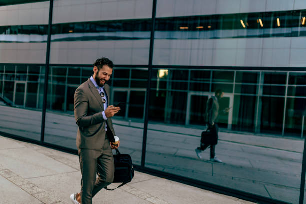 istock Businessman Using Smartphone in the Urban Environment 1160555268