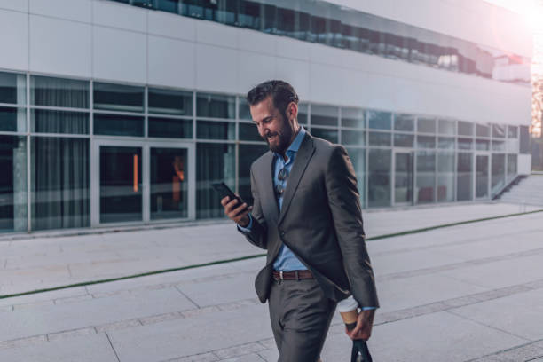 istock Businessman Using Smartphone in the Urban Environment 1160555305