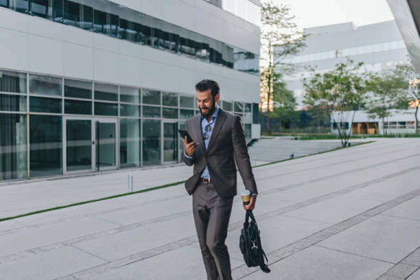 istock Businessman Using Smartphone in the Urban Environment 1160556520