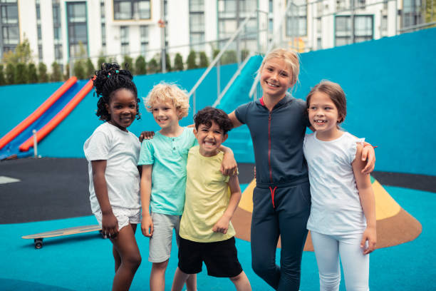 istock Cheerful school children posing for their group photograph. 1160559151