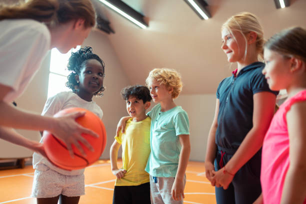 istock Children listening to coach explaining rules of the game. 1160559255